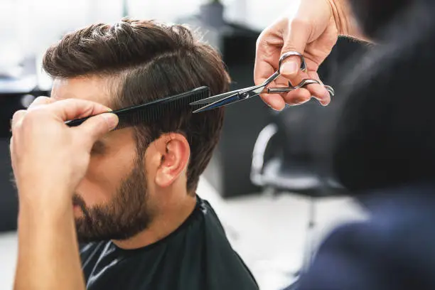 Fama Barber Shop and Beauty Salon Logo